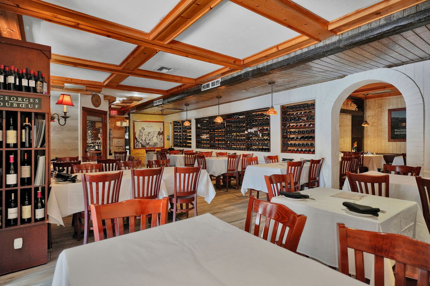 Main dining room with wine wall and coffered ceiling